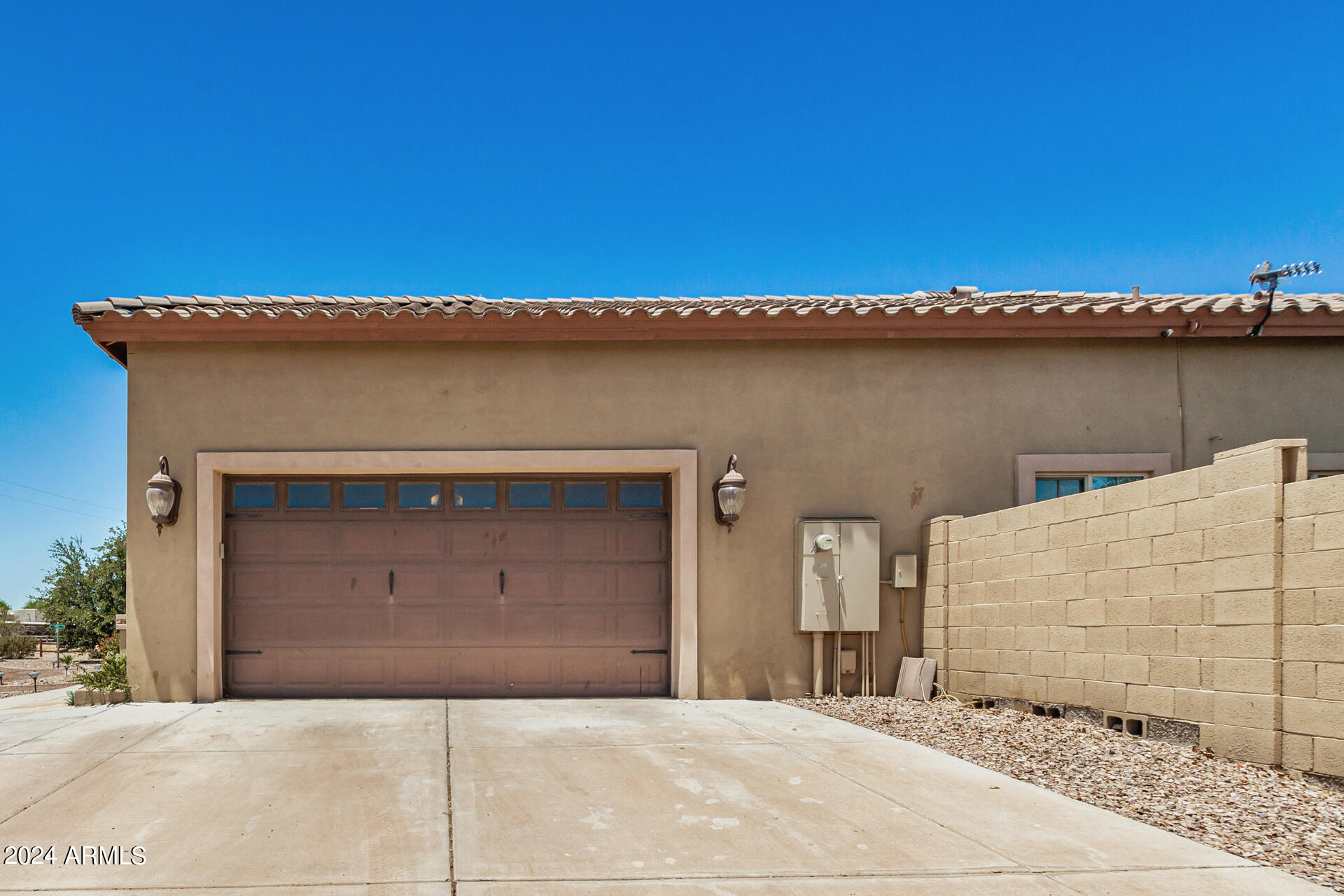 20716 West Telegram Path Road Buckeye, AZ 85326 - Photo 14 of 65 a front view of a house with a garage