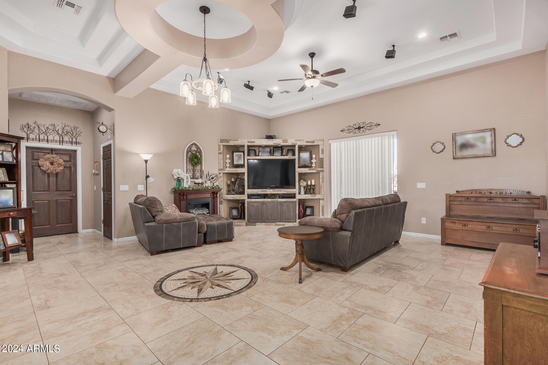 20716 West Telegram Path Road Buckeye, AZ 85326 - Photo 17 of 65 a living room with furniture and a flat screen tv