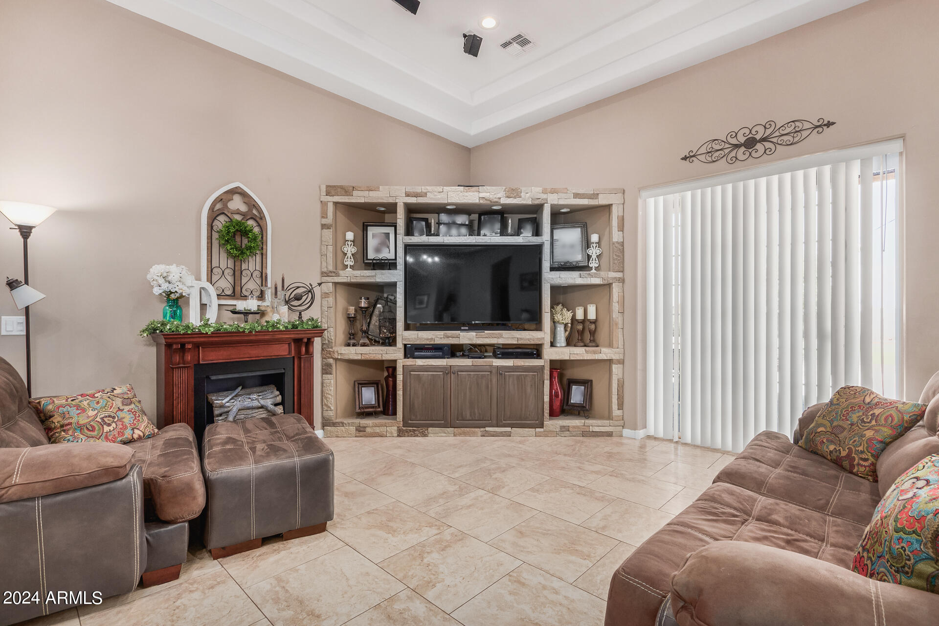 20716 West Telegram Path Road Buckeye, AZ 85326 - Photo 18 of 65 a living room with furniture and a flat screen tv