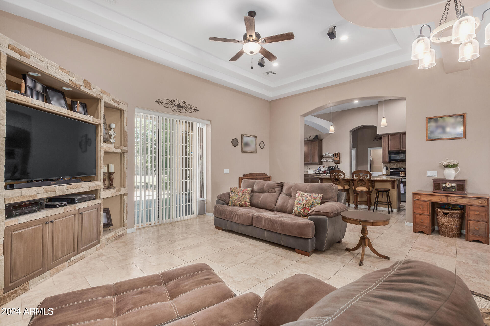 20716 West Telegram Path Road Buckeye, AZ 85326 - Photo 20 of 65 a living room with furniture and a flat screen tv