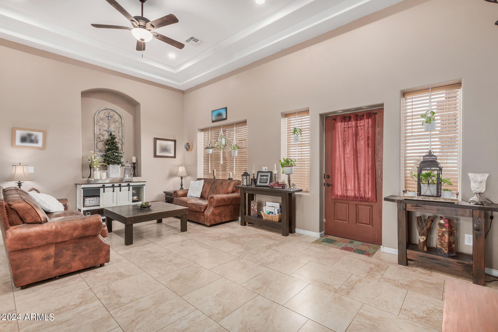 20716 West Telegram Path Road Buckeye, AZ 85326 - Photo 23 of 65 a living room with furniture and a fireplace