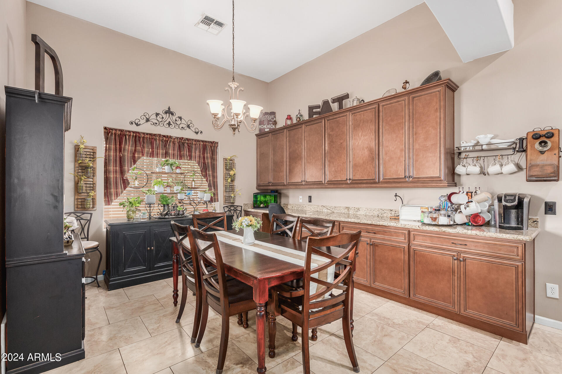 20716 West Telegram Path Road Buckeye, AZ 85326 - Photo 29 of 65 a view of a dining room with furniture a chandelier and wooden floor