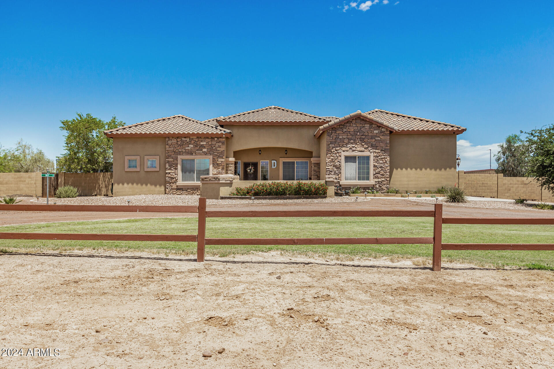 20716 West Telegram Path Road Buckeye, AZ 85326 - Photo 3 of 65 a front view of a house with a yard