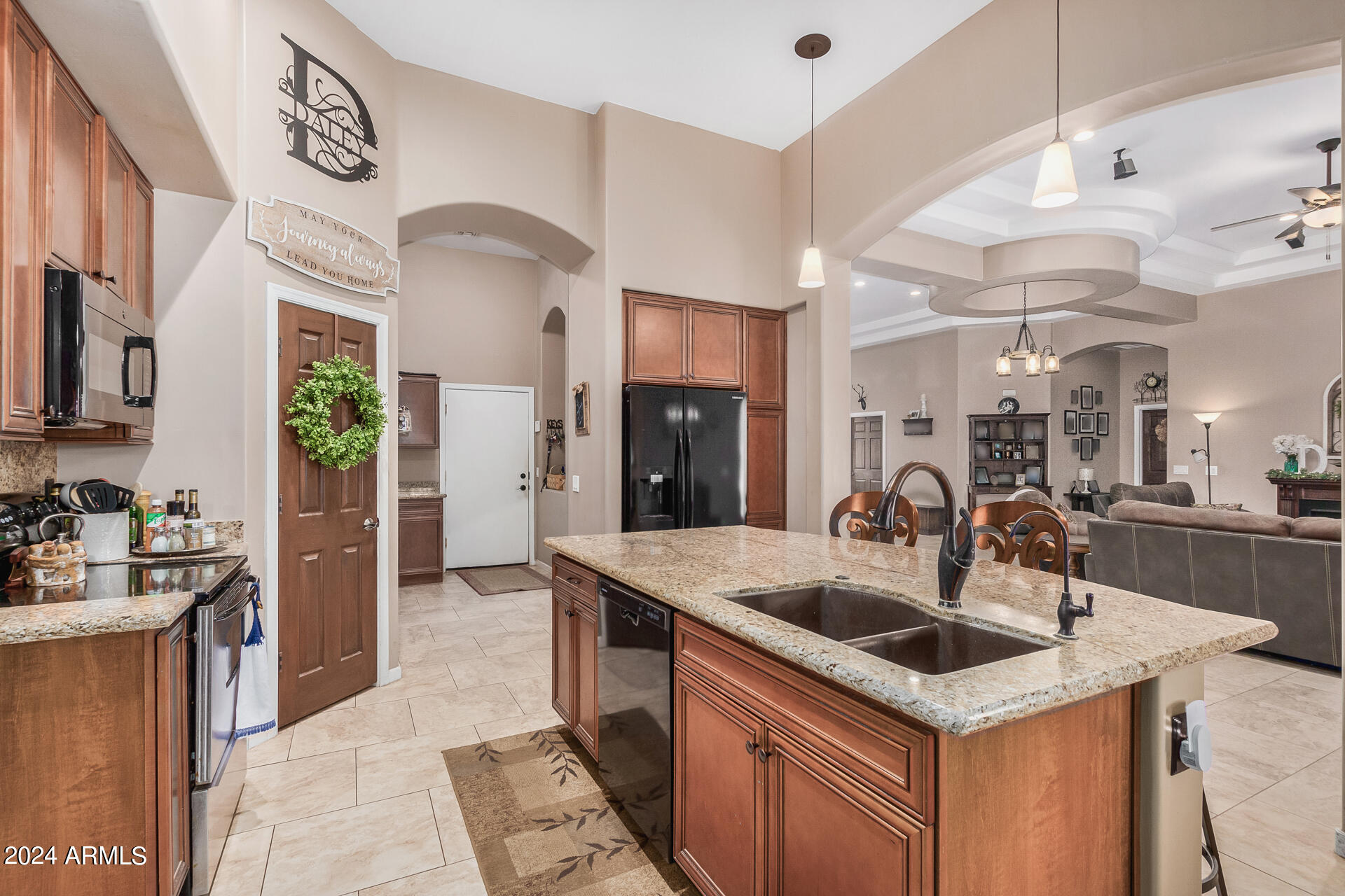 20716 West Telegram Path Road Buckeye, AZ 85326 - Photo 32 of 65 a kitchen with a sink a counter space and stainless steel appliances