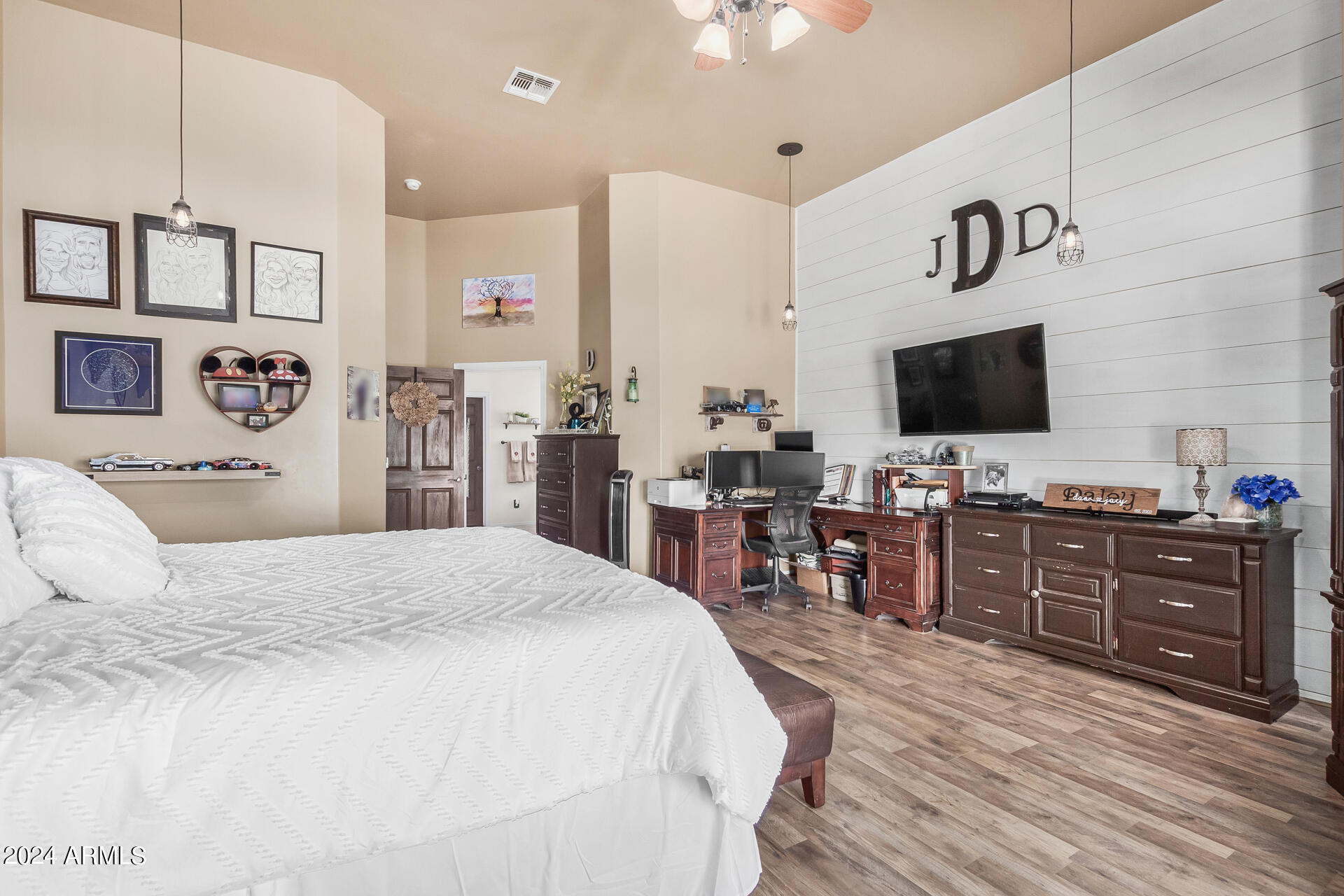 20716 West Telegram Path Road Buckeye, AZ 85326 - Photo 36 of 65 a bedroom with a bed and furniture