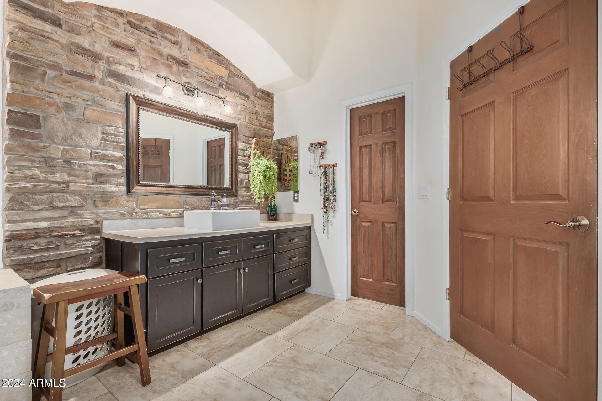 20716 West Telegram Path Road Buckeye, AZ 85326 - Photo 41 of 65 a spacious bathroom with a granite countertop sink and a mirror
