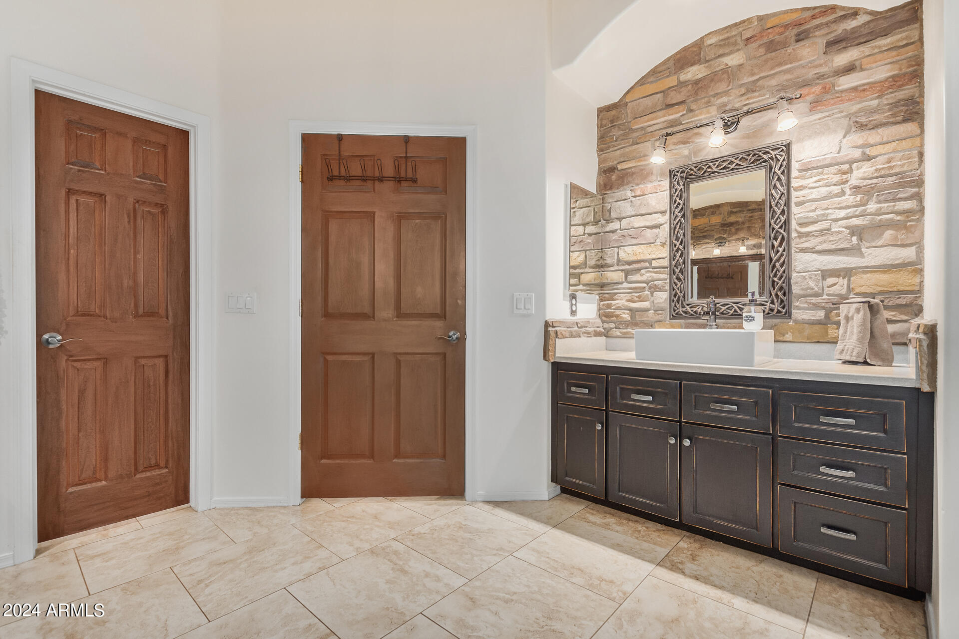 20716 West Telegram Path Road Buckeye, AZ 85326 - Photo 42 of 65 a spacious bathroom with a vanity a sink a mirror and a bathtub