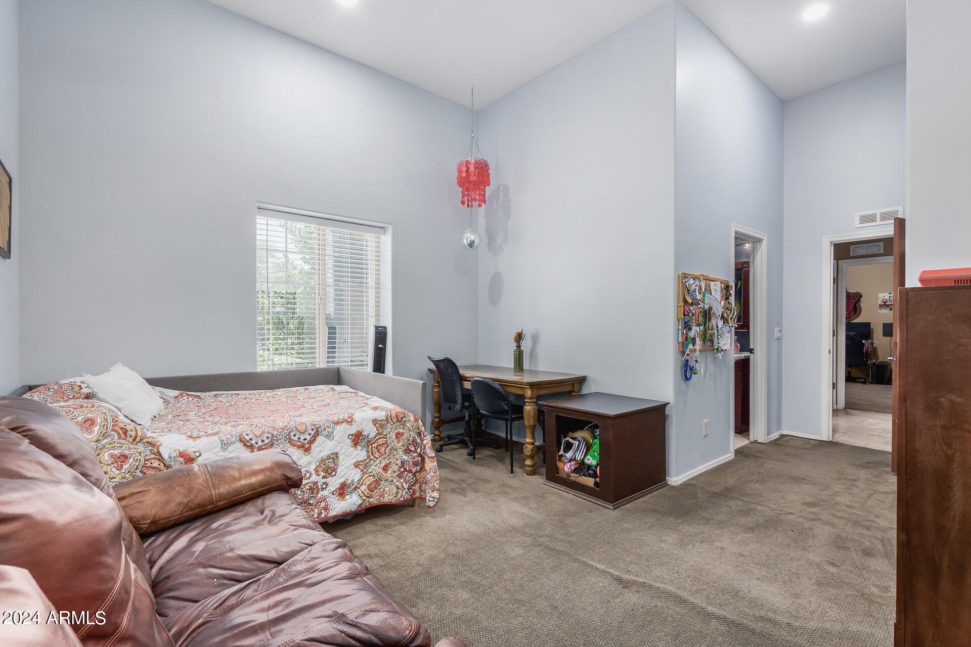 20716 West Telegram Path Road Buckeye, AZ 85326 - Photo 45 of 65 a bedroom with a bed and a window