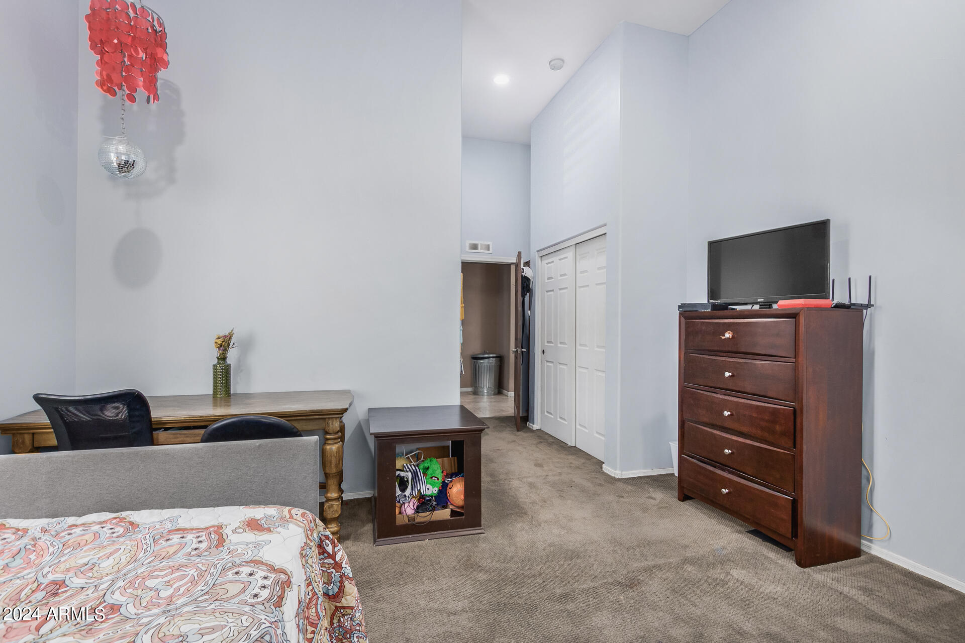 20716 West Telegram Path Road Buckeye, AZ 85326 - Photo 46 of 65 a bedroom with a bed and a television