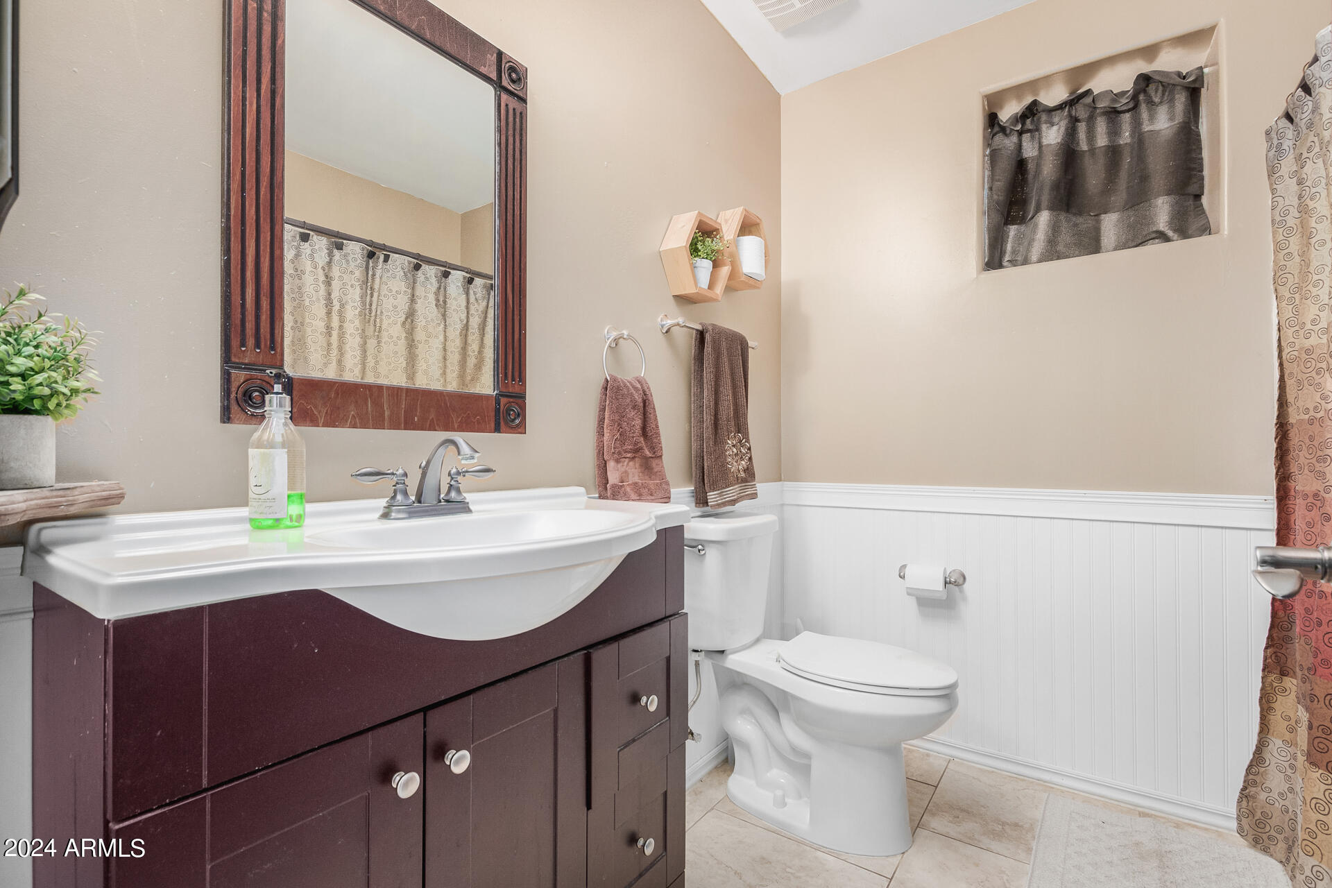 20716 West Telegram Path Road Buckeye, AZ 85326 - Photo 53 of 65 a bathroom with a sink a toilet and mirror