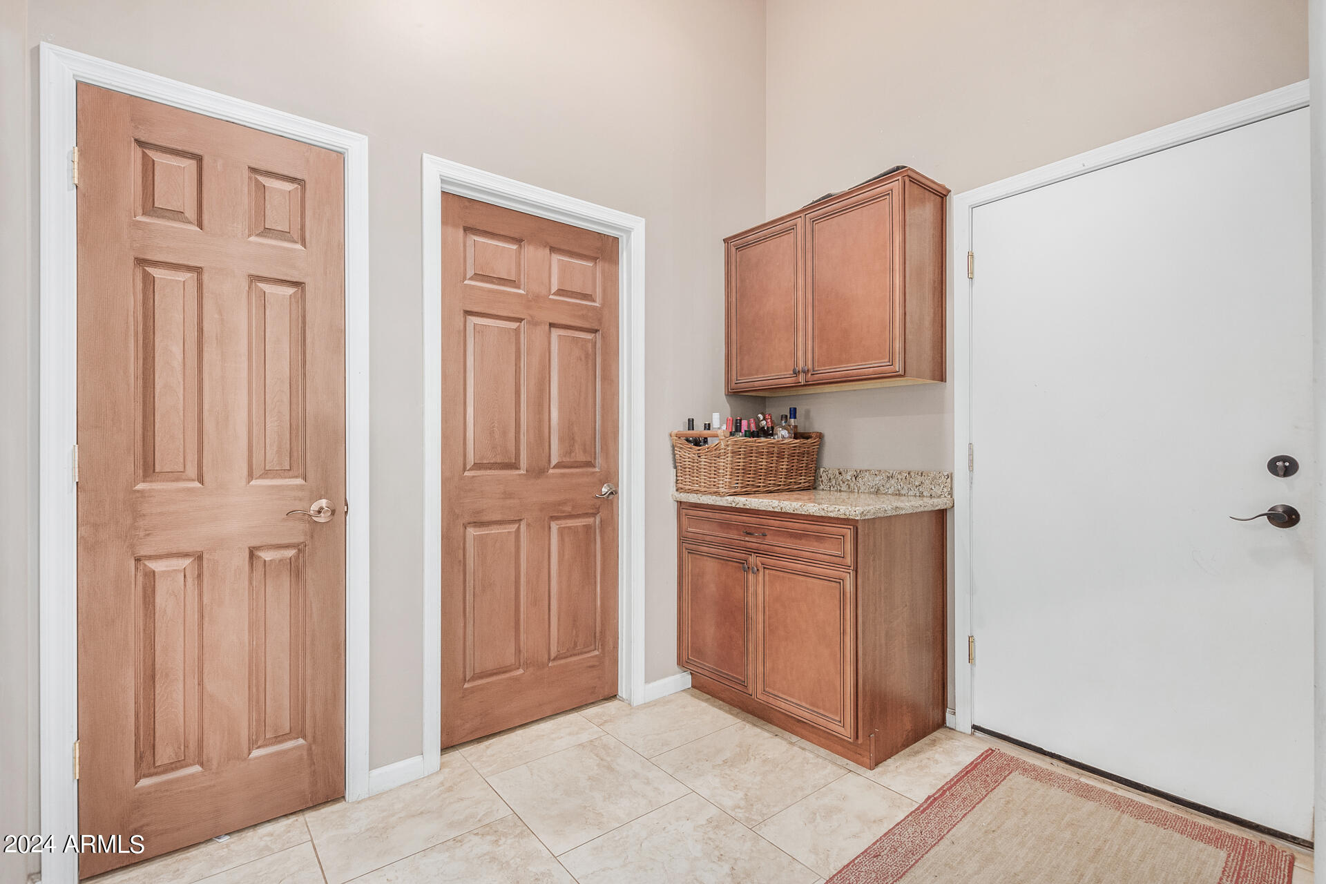 20716 West Telegram Path Road Buckeye, AZ 85326 - Photo 54 of 65 a kitchen with granite countertop white cabinets and stainless steel appliances