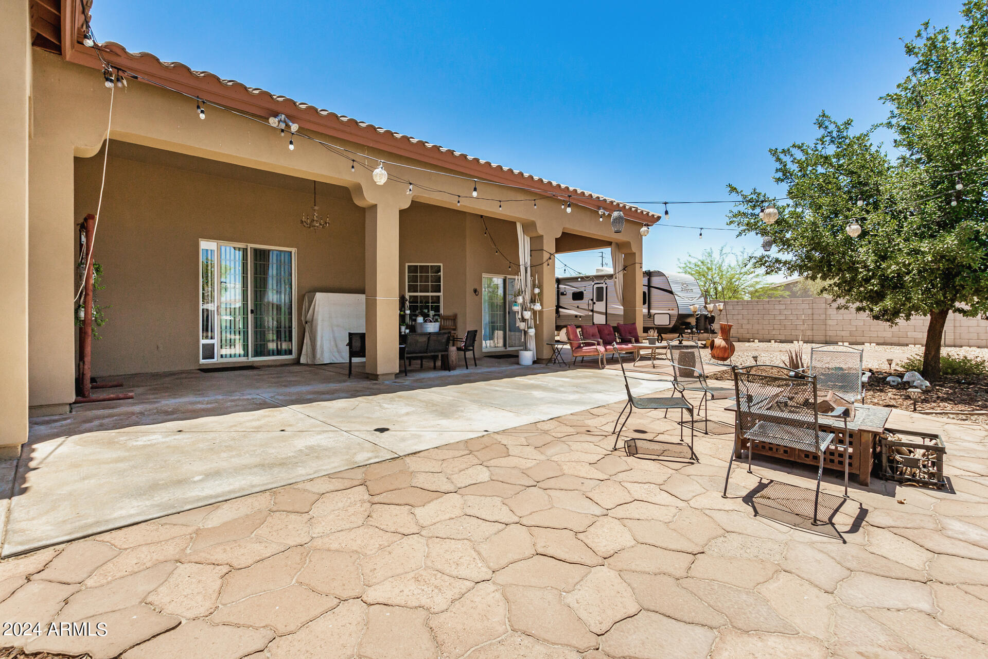 20716 West Telegram Path Road Buckeye, AZ 85326 - Photo 57 of 65 a view of a house with sitting area and furniture