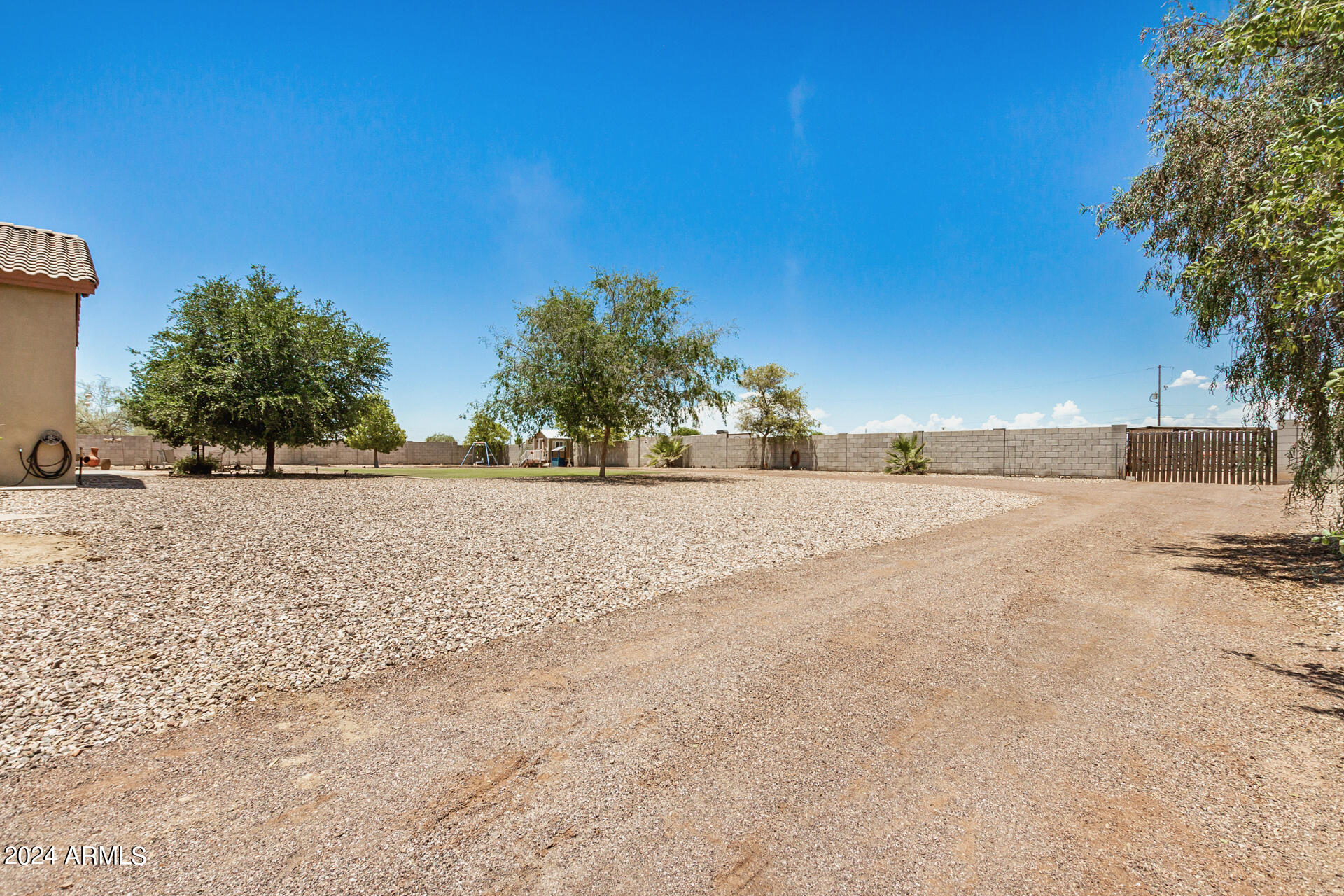 20716 West Telegram Path Road Buckeye, AZ 85326 - Photo 59 of 65 a view of dirt road with a building in the background