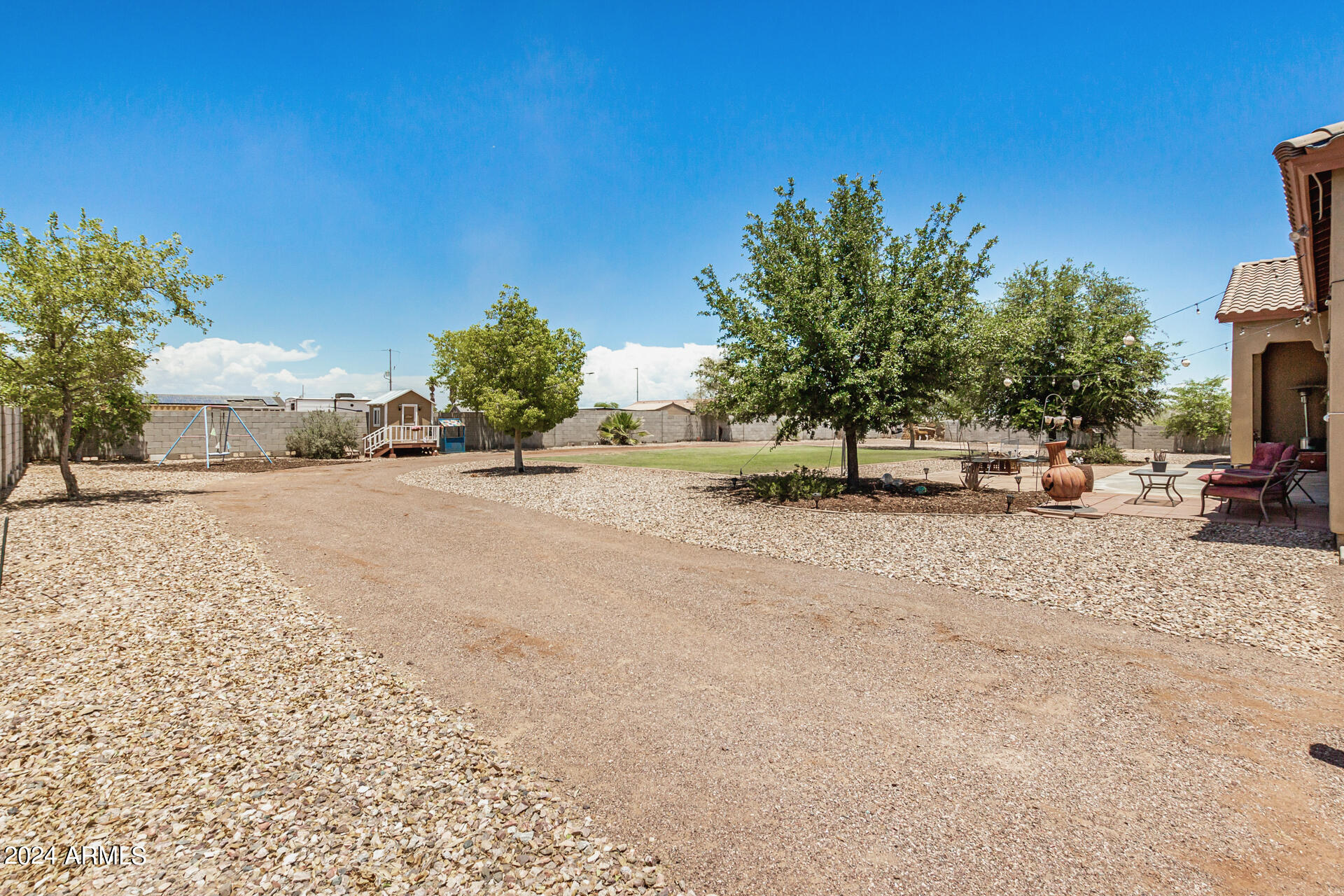 20716 West Telegram Path Road Buckeye, AZ 85326 - Photo 60 of 65 a view of road with card parked on side and retail shops