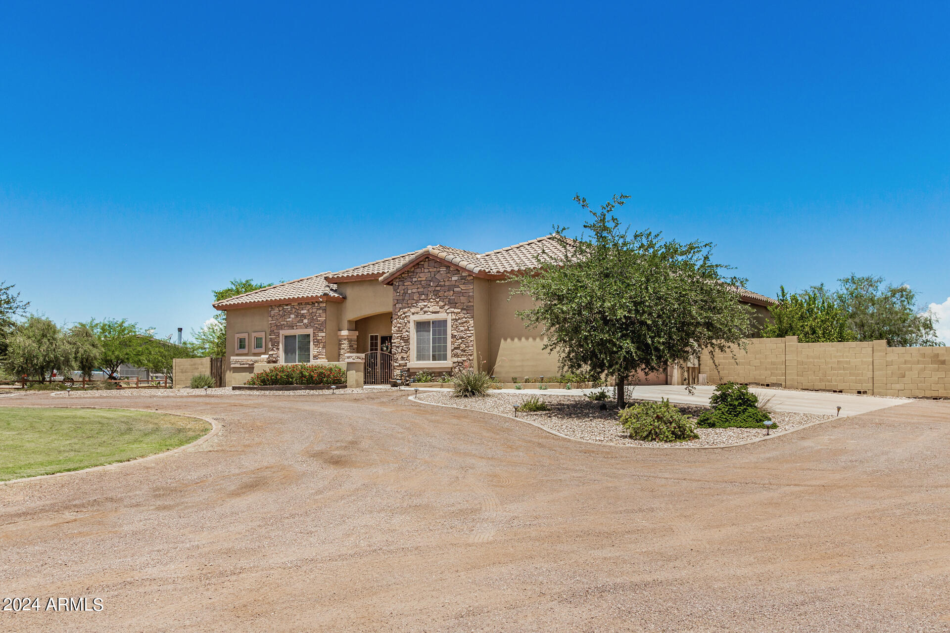 20716 West Telegram Path Road Buckeye, AZ 85326 - Photo 7 of 65 a front view of a house with a yard