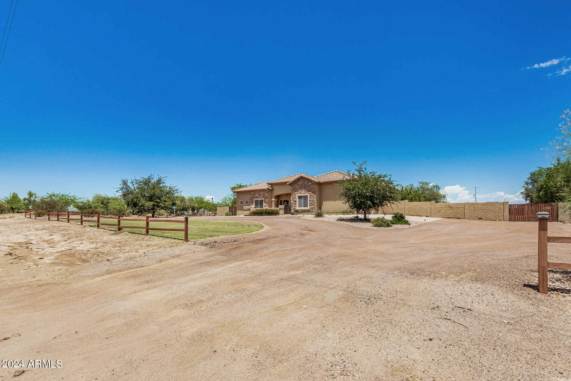 20716 West Telegram Path Road Buckeye, AZ 85326 - Photo 9 of 65 a view of dirt road with a building in the background