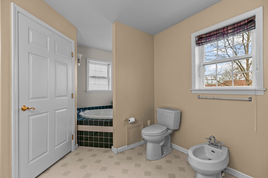 780 Dickinson Street Fall River, MA 02721 - Photo 22 of 42 a bathroom with a toilet sink and window