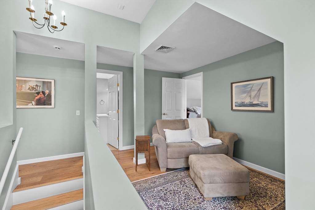 780 Dickinson Street Fall River, MA 02721 - Photo 27 of 42 a living room with furniture and a rug
