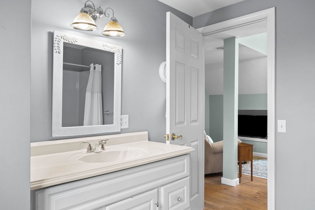 780 Dickinson Street Fall River, MA 02721 - Photo 33 of 42 a en suite bathroom with a sink and a mirror