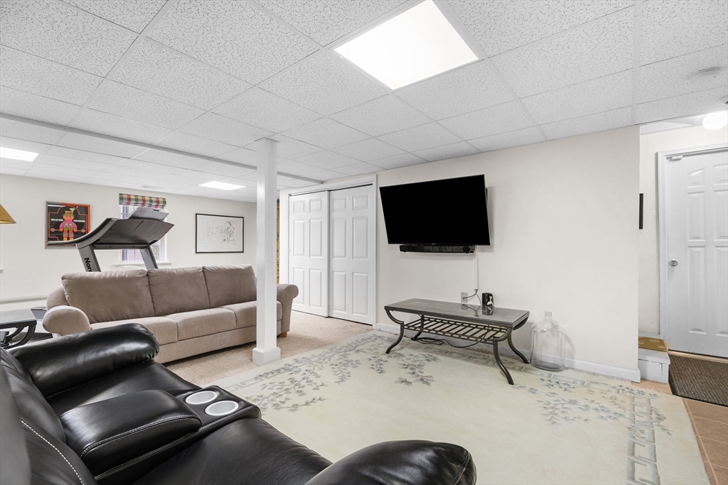780 Dickinson Street Fall River, MA 02721 - Photo 34 of 42 a living room with furniture and a flat screen tv