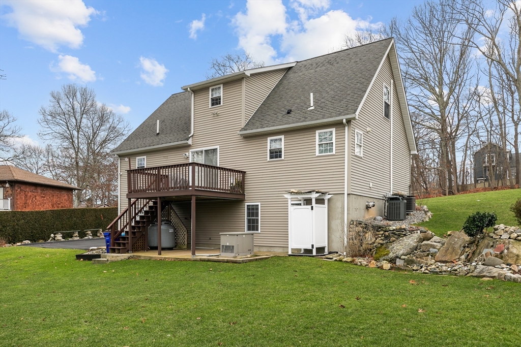 780 Dickinson Street Fall River, MA 02721 - Photo 4 of 42 a view of a house with a yard and sitting area