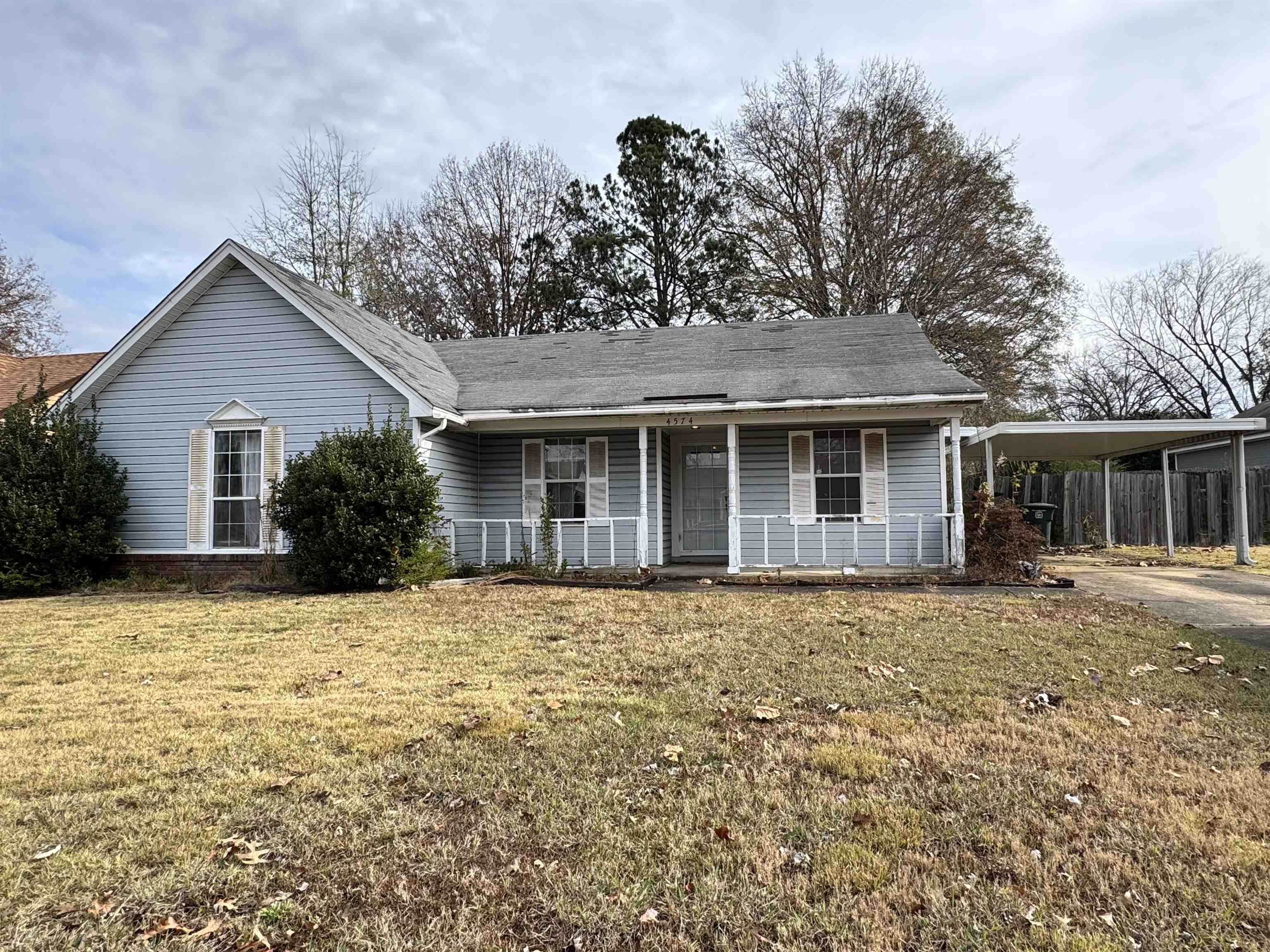 4574 Ross Road Memphis, TN 38141 - Photo 1 of 15 a front view of a house with a garden