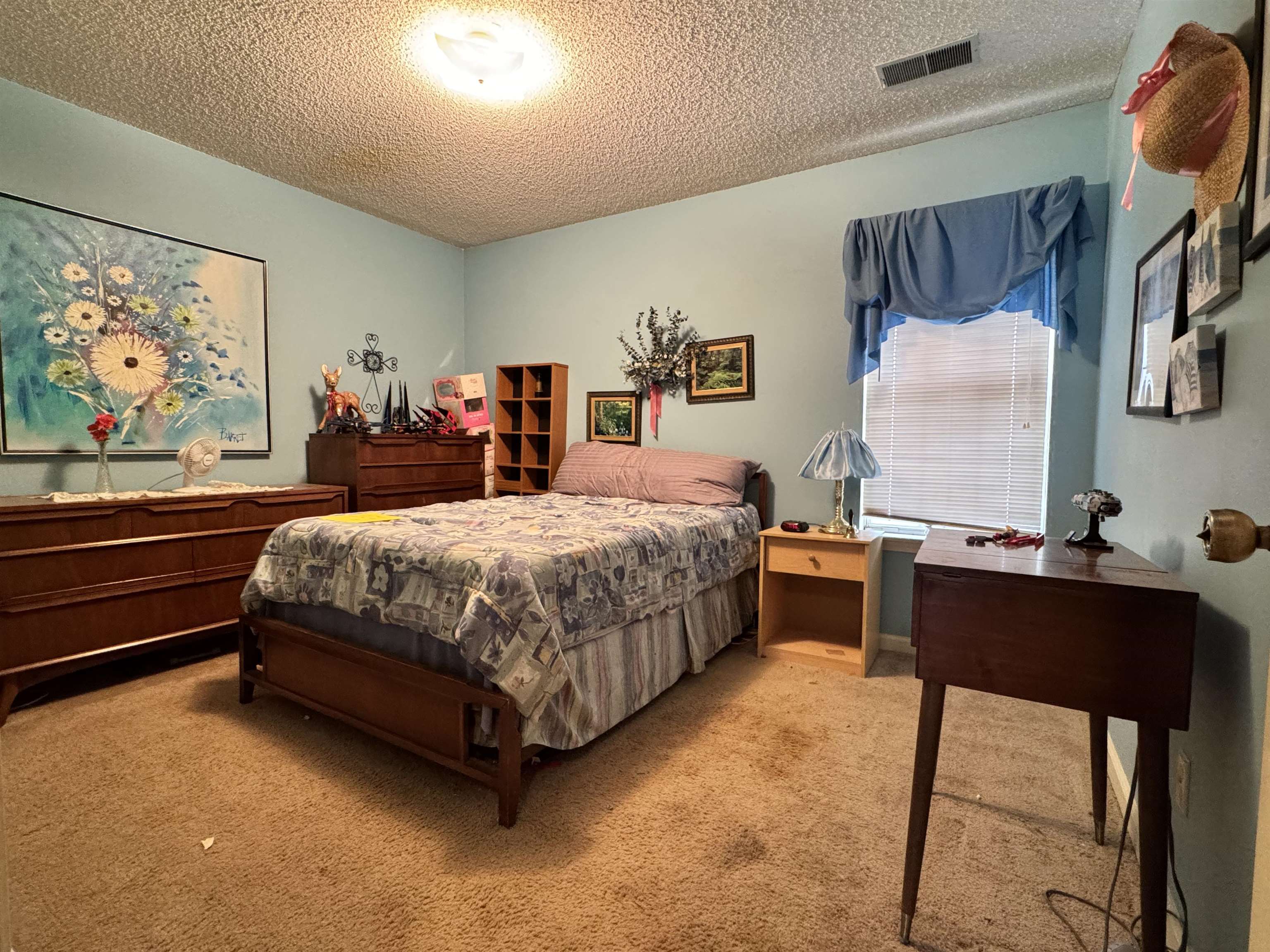 4574 Ross Road Memphis, TN 38141 - Photo 12 of 15 a bedroom with a bed and a desk