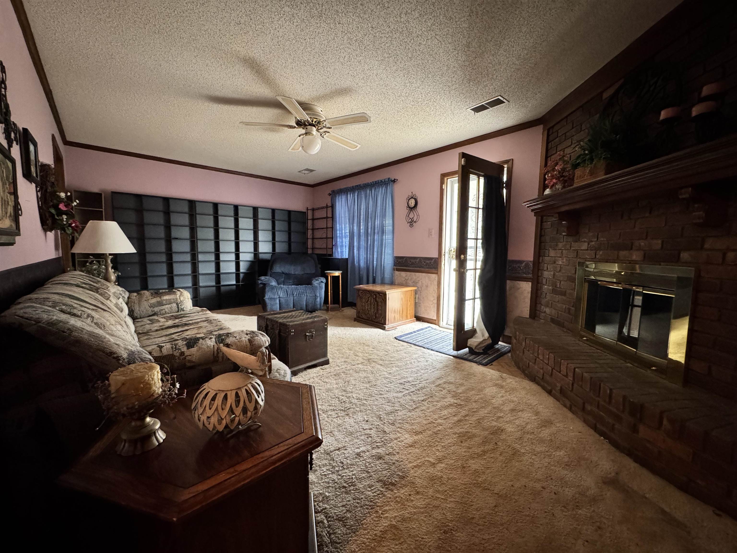 4574 Ross Road Memphis, TN 38141 - Photo 6 of 15 a living room with furniture and a fireplace