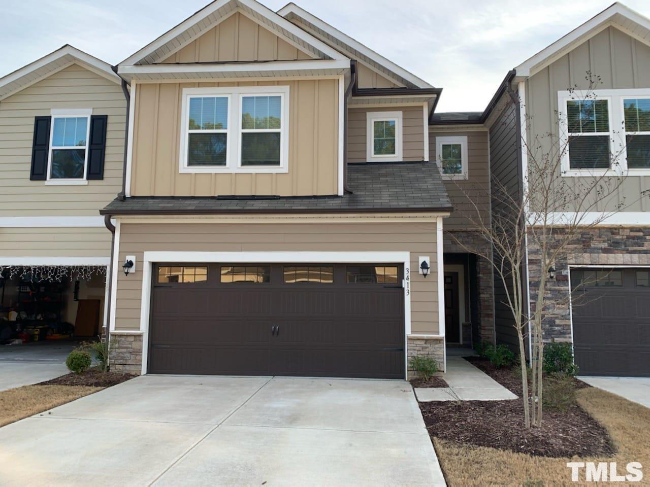 a front view of a house with yard