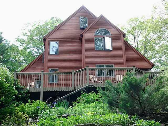 200 Burrows Hill Road Hebron, CT 06231 - Photo 1 of 1 a front view of a house with garage and plants