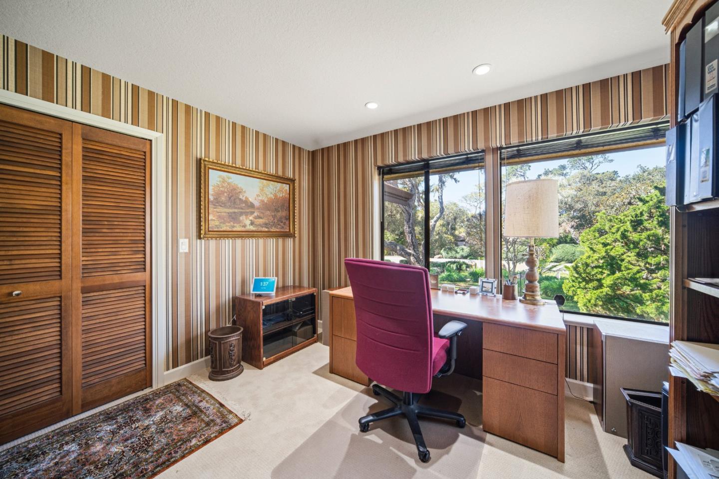 2911 Colton Road Pebble Beach, CA 93953 - Photo 34 of 46 a living room with furniture a flat screen tv and a window