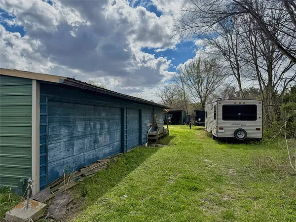a view of a backyard with a garden and washing machine