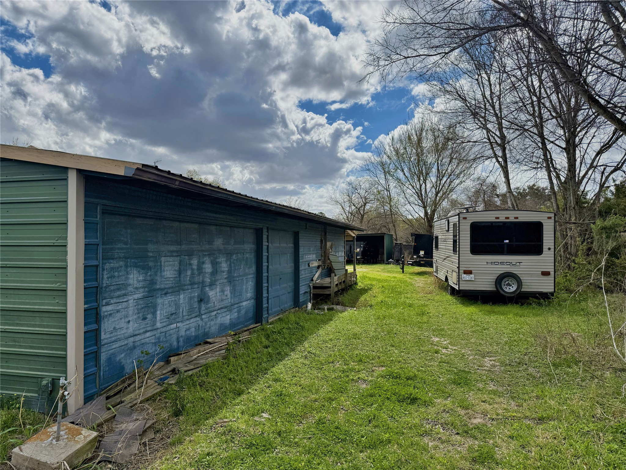 25118 Roesner Lane Katy, TX 77494 - Photo 7 of 14 a view of a backyard with a garden and washing machine