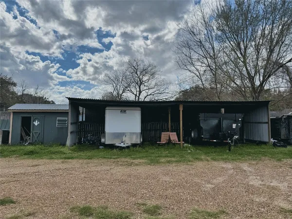 a view of a house with a yard and garage