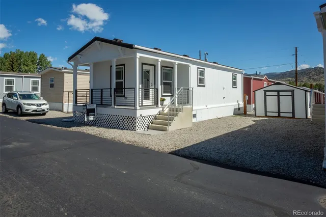 a front view of a house with a gate