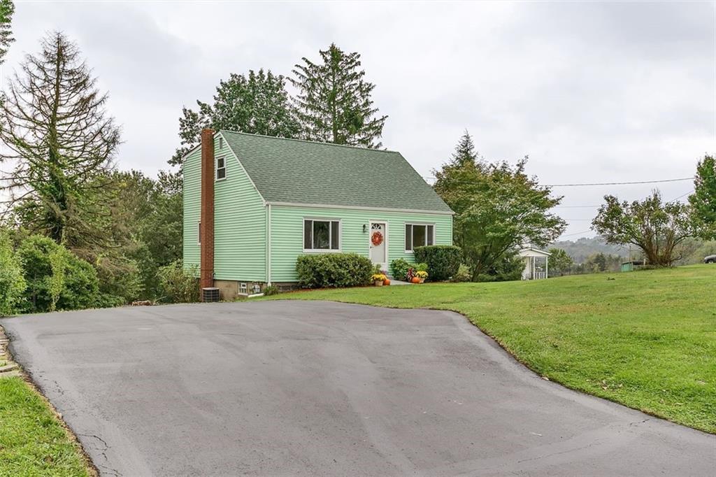 320 Center New Texas Road Pittsburgh, PA 15239 - Photo 2 of 25 a front view of a house with a yard and trees