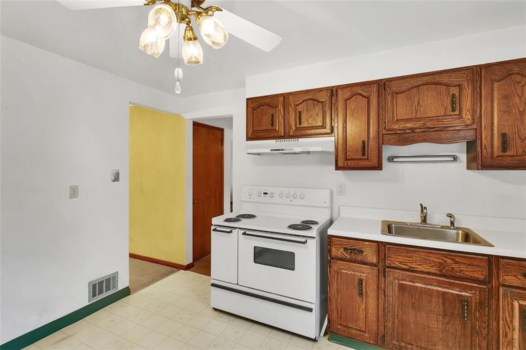 320 Center New Texas Road Pittsburgh, PA 15239 - Photo 11 of 25 a kitchen with stainless steel appliances granite countertop a stove and a sink