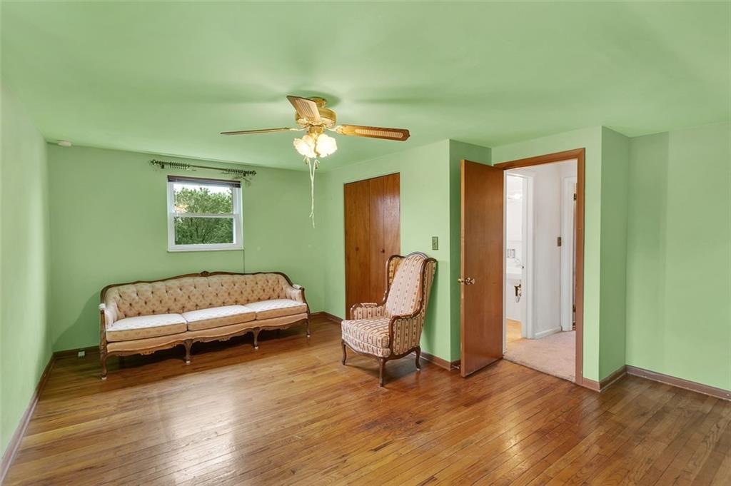 320 Center New Texas Road Pittsburgh, PA 15239 - Photo 17 of 25 a bedroom with a bed and a chandelier