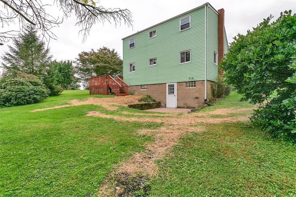 320 Center New Texas Road Pittsburgh, PA 15239 - Photo 24 of 25 a front view of a house with a yard