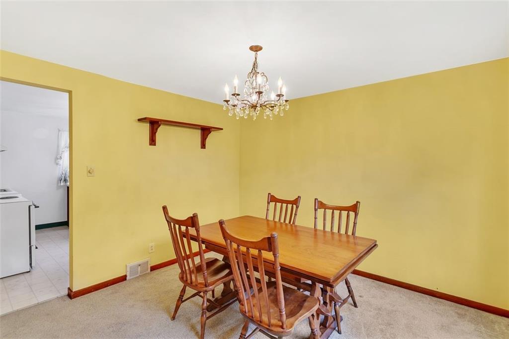 320 Center New Texas Road Pittsburgh, PA 15239 - Photo 7 of 25 a view of a dining room with furniture and chandelier