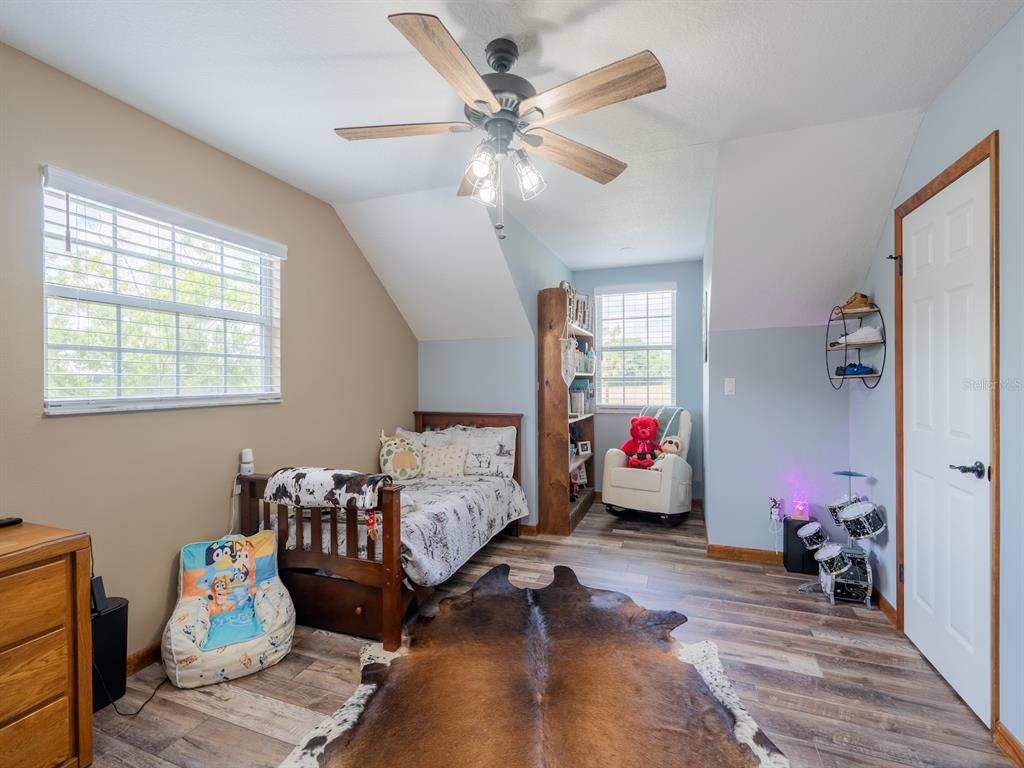 4381 Northeast 105th Place Anthony, FL 32617 - Photo 33 of 49 a living room with furniture and wooden floor
