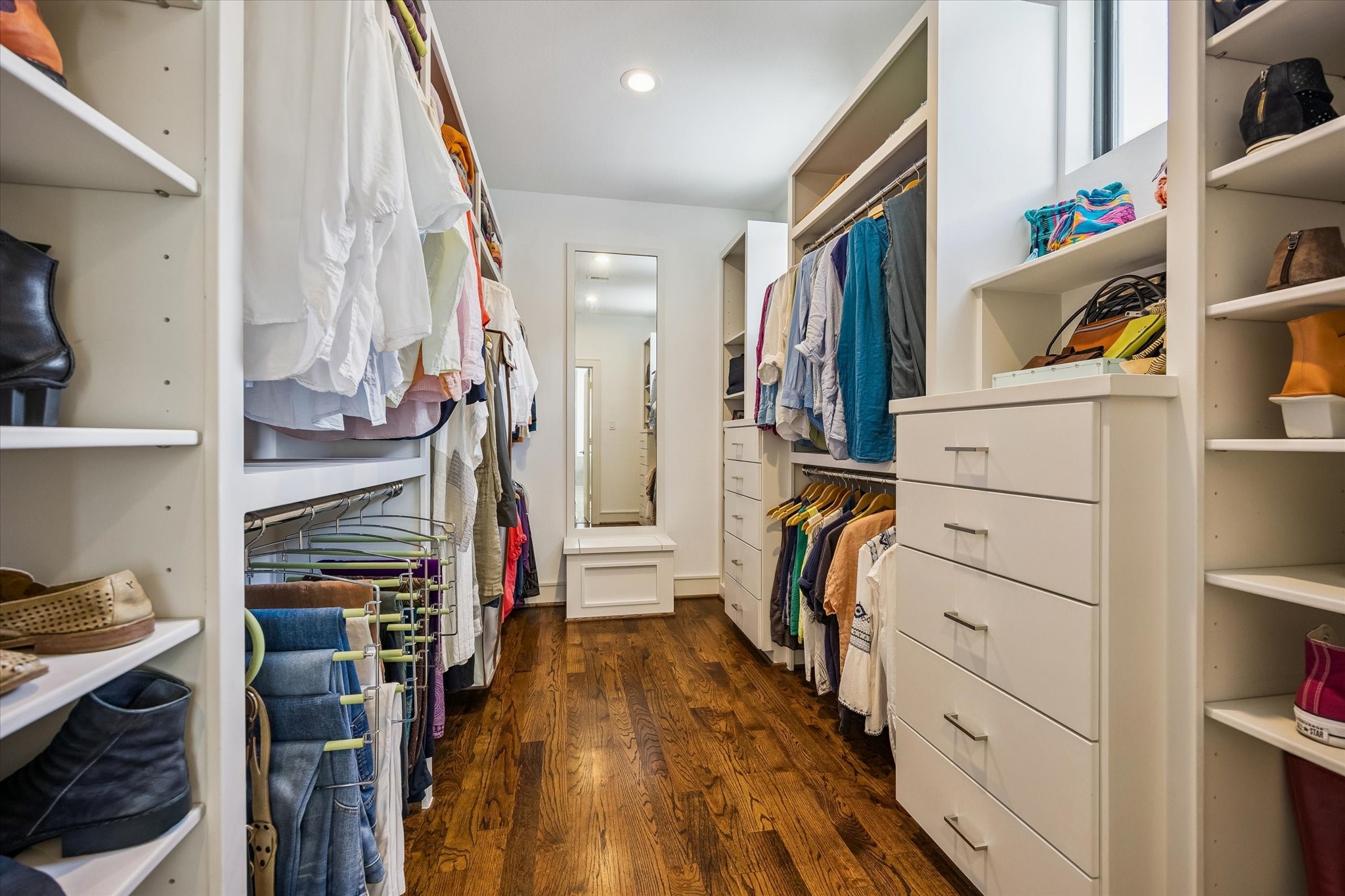 1810 Ridgewood Street Houston, TX 77006 - Photo 20 of 30 Fabulous walk-in closet off the Primary Bath has hardwoods, plenty of hanging, shelving and drawer space. The other walk-in closet is off the Primary Bedroom.