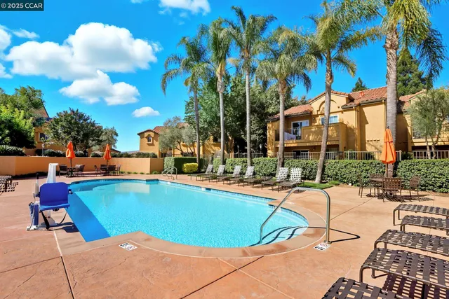a view of a swimming pool with a lounge chairs
