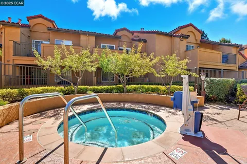 a view of a swimming pool with a patio