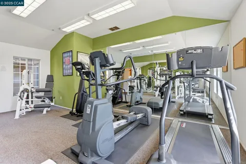 a view of a living room with hardwood floor and a window