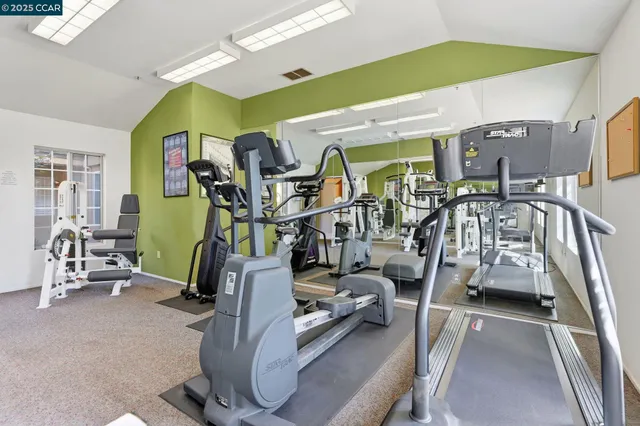a view of a living room with hardwood floor and a window