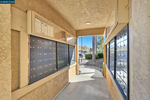 a view of a swimming pool with an outdoor seating