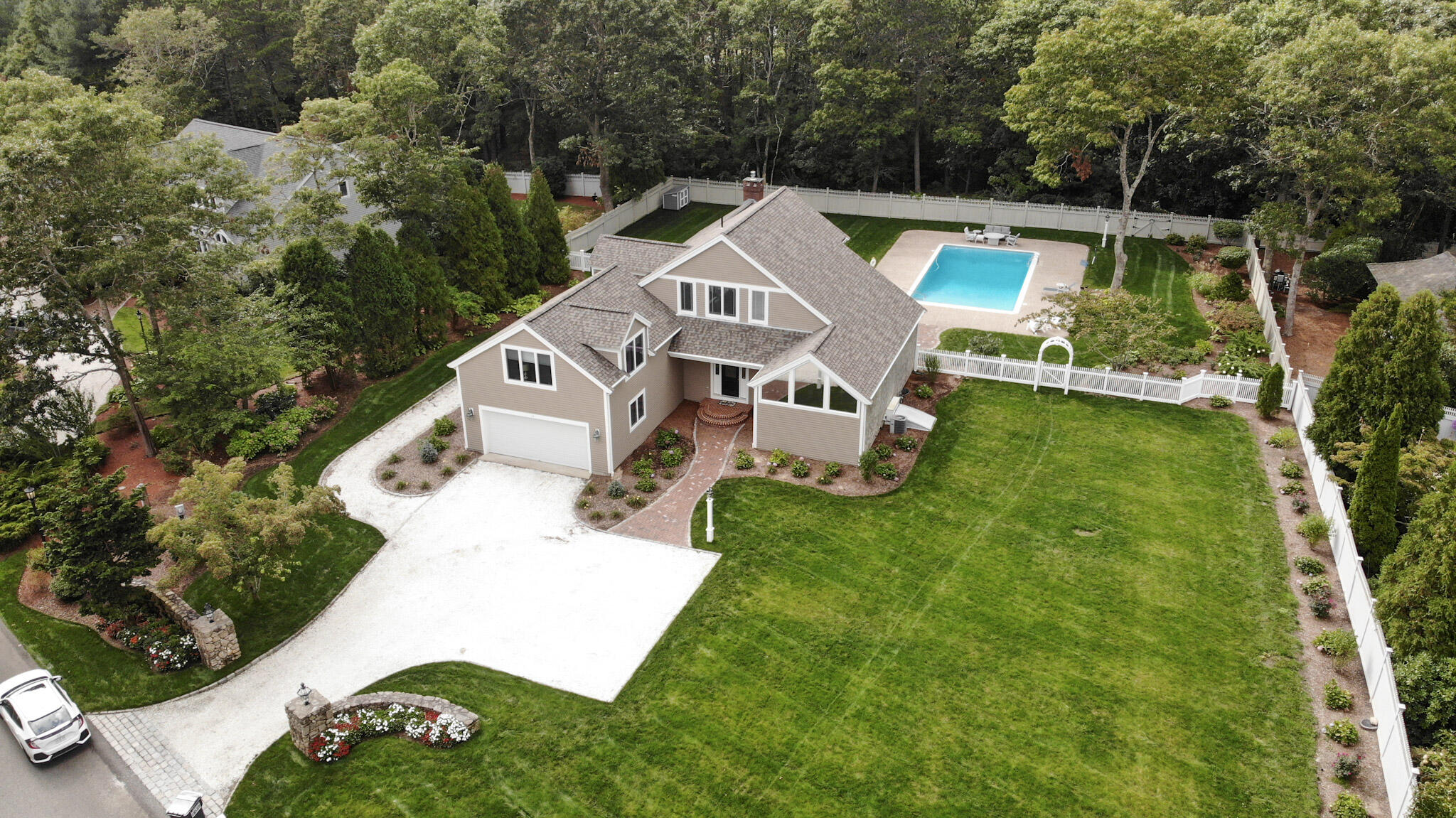 14 Shoestring Bay Road Mashpee, MA 02649 - Photo 3 of 66 an aerial view of a house with a yard