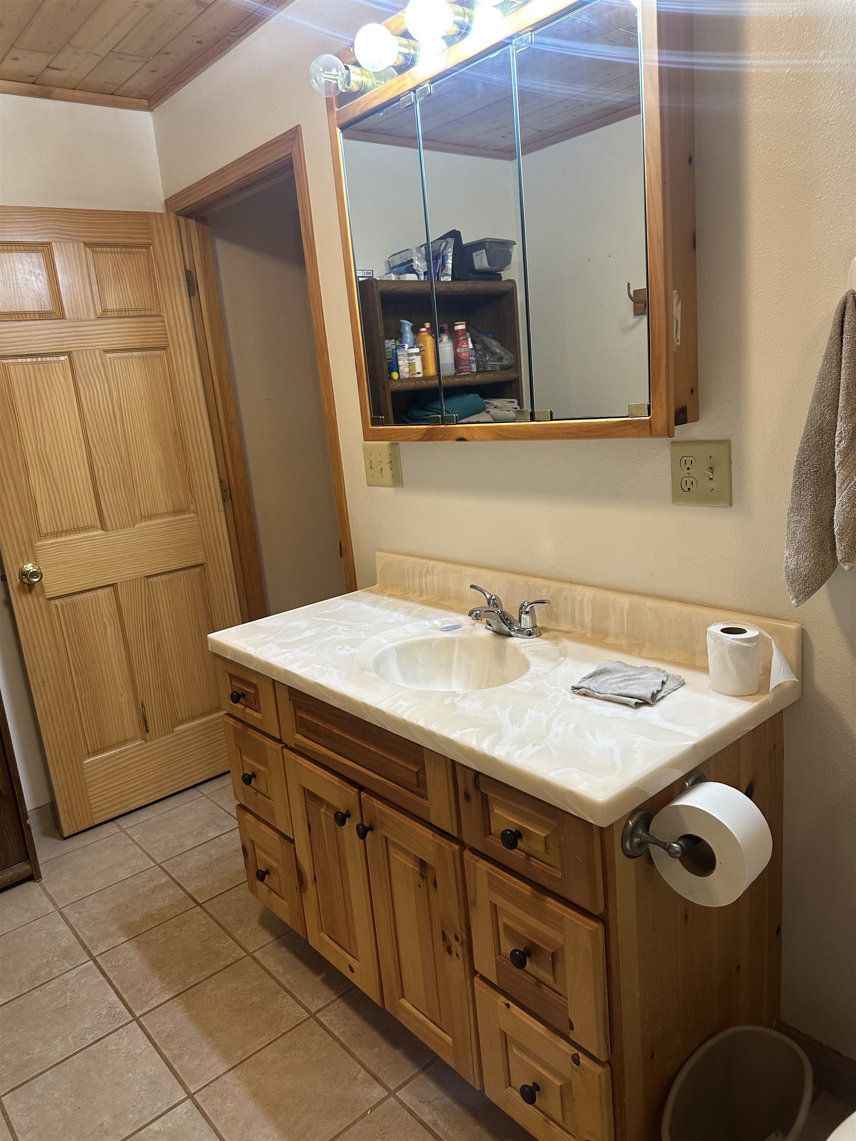 58875 Roy Anderson Road Mason, WI 54856 - Photo 13 of 26 Bathroom with vanity, tile patterned floors, and wood ceiling