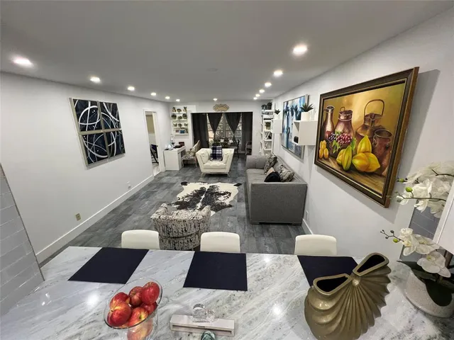 a living room with furniture and a rug